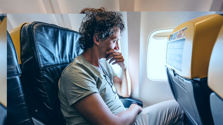 Man dealing with flight anxiety