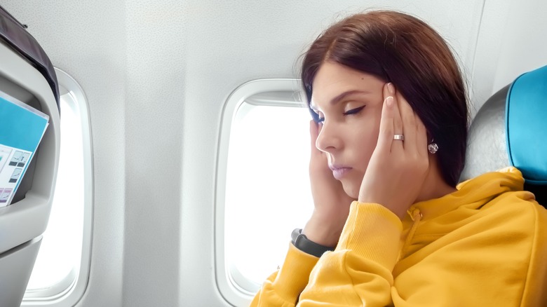 girl sick on airplane