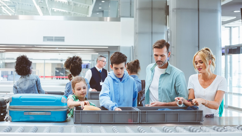 Family in line at airport security