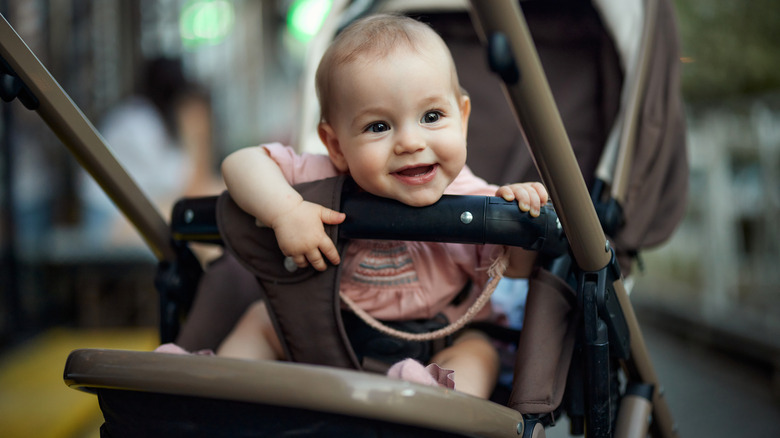 Smiling baby in stroller
