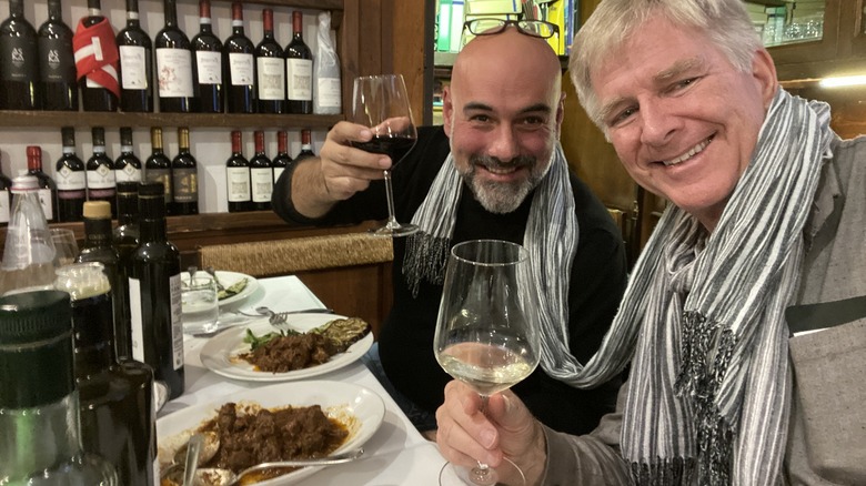 Rick Steves toasting with Italian tour guide