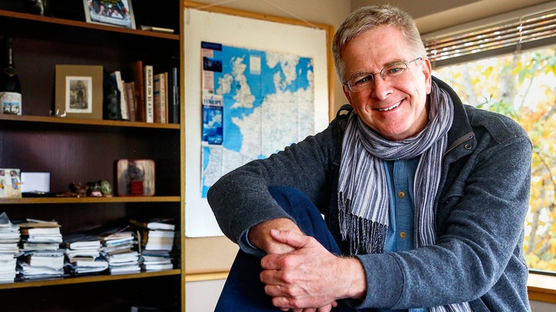 Rick Steves in an office with Europe map