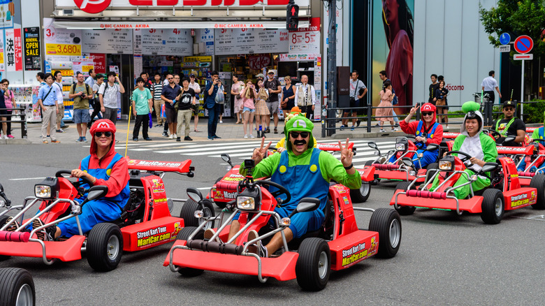 Tokyo cosplayers driving MariCar Mario Karts