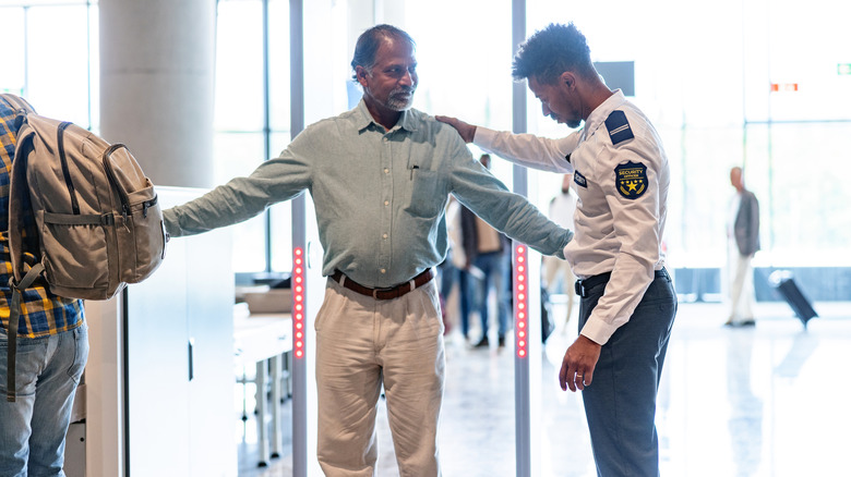 man and airport security officer