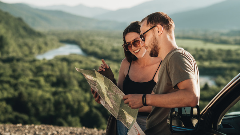 couple holding a map