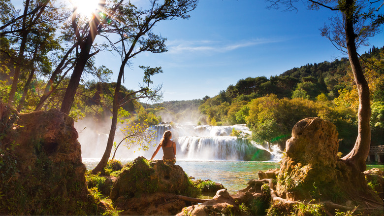 Woman admiring waterfall in Krka
