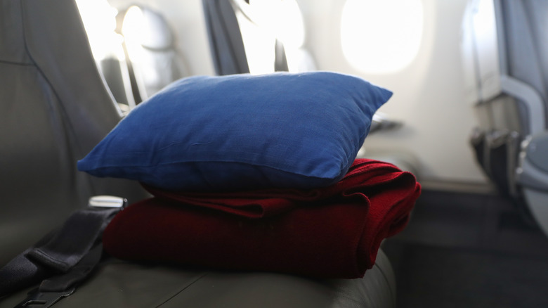 pillow and blanket on plane